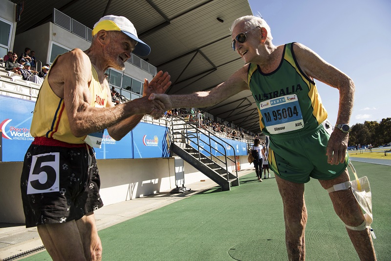 Dumitru Radu, left, a 90-year-old Romanian, and Australian John Gilmour, 97, after both ran in the 800m event — both were the only competitors in their different age groups — at the World Masters Athletics Championships in Perth, Australia, October 28, 2016. Despite impaired vision, Gilmour once set world masters records from 800 meters to the marathon, and went 10 years without a defeat on the track. In his mid-60s, he could still run a marathon in less than three hours. — Picture by David Dare Parker/The New York Times