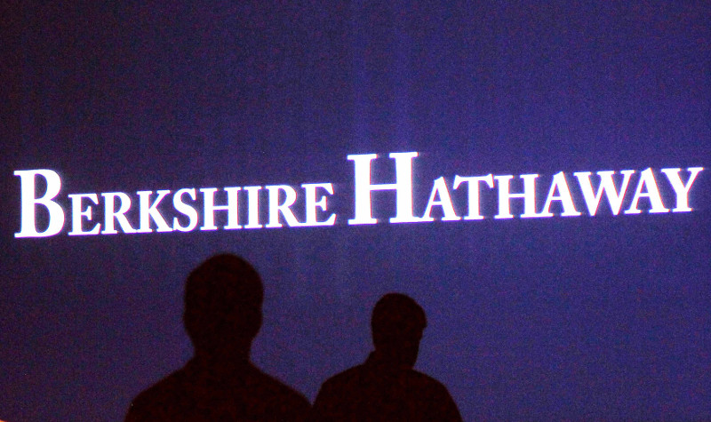 Berkshire Hathaway shareholders walk by a video screen at the companyu00e2u20acu2122s annual meeting in Omaha May 4, 2013. u00e2u20acu201d Reuters pic