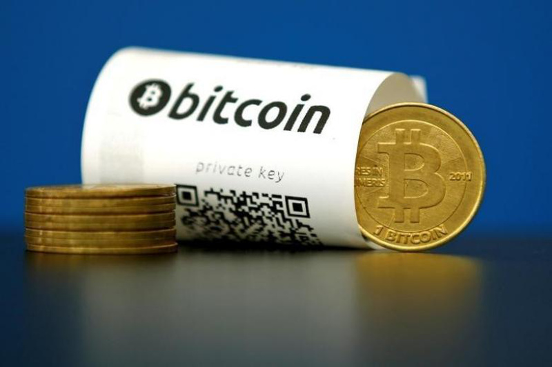 A Bitcoin (virtual currency) paper wallet with QR codes and a coin are seen in an illustration picture taken at La Maison du Bitcoin in Paris, France, May 27, 2015. u00e2u20acu201dReuters pic