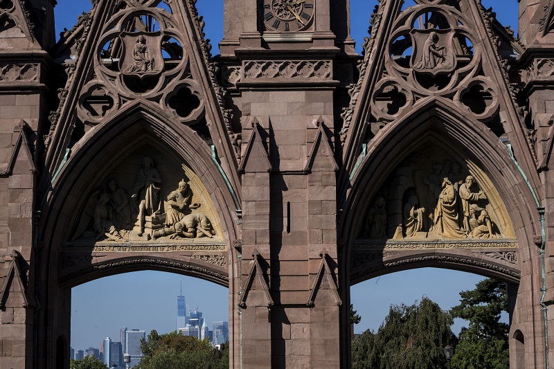 A glimpse of Lower Manhattan through the Gothic Revival gates of the Green-Wood cemetery in Brooklyn, October 7, 2016.
