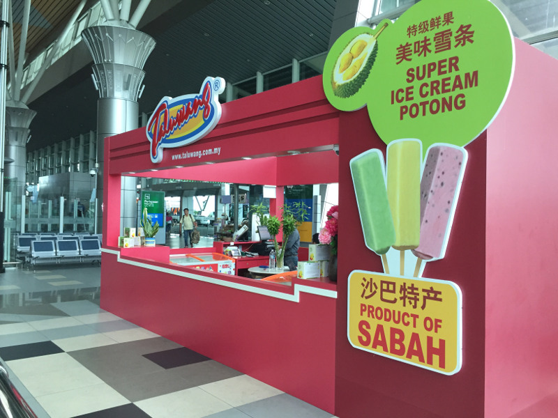 The trend of tourists buying ice cream potong as a souvenir became so popular that a kiosk was opened at the Kota Kinabalu International Airport. u00e2u20acu201d Picture by Julia Chan