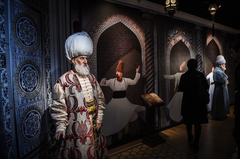 A visitor stands next to a wax statues of Ottoman ruler Suleiman the Magnificent (left) and Persian poet Mevlana Jaladdin Rumi (right) at the world's 21st Madame Tussauds wax museum in Istanbul. u00e2u20acu201d AFP pic 