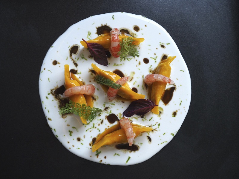 An undated handout photo of ravioli with guinea fowl, coconut, lime and red shrimp from the restaurant Local in Venice. Everything that Local serves originates nearby, or at least has a Venetian twist. u00e2u20acu201d Handout via The New York Times