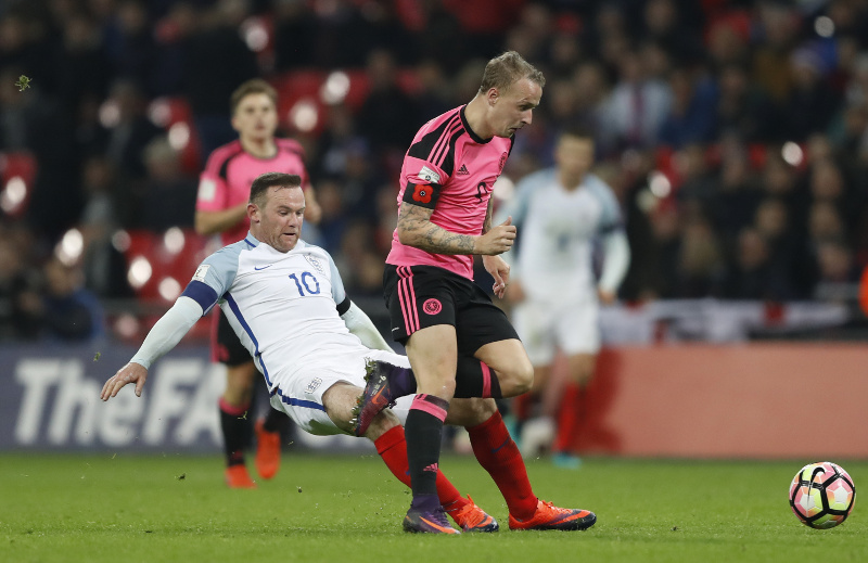 England's Wayne Rooney is shown a yellow card for this challenge on Scotland's Leigh Griffiths during their 2018 World Cup Qualifying European Zone - Group F match at Wembley Stadium, London, November 11, 2016. u00e2u20acu201d Reuters pic