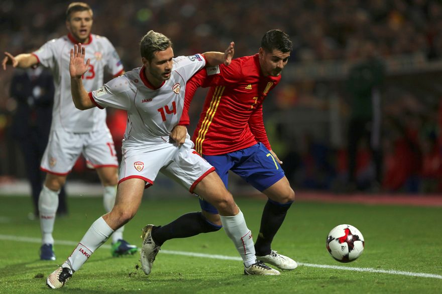 Spain's Alvaro Morata (right) and Macedonia's Darko Velkovski in World Cup qualifying action in Granada November 12, 2016. u00e2u20acu201d Reuters pic