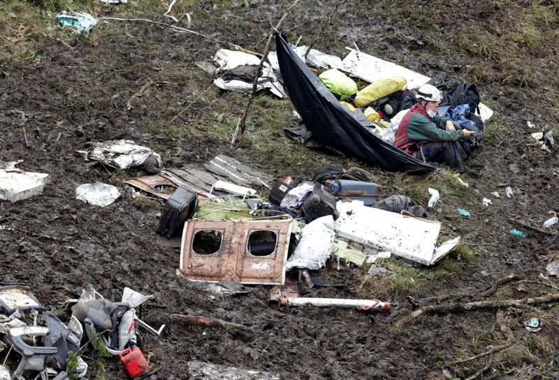 A rescue worker sits near the wreckage of a plane that crashed into the Colombian jungle with Brazilian football team Chapecoense onboard near Medellin November 29, 2016. u00e2u20acu201d Reuters pic 