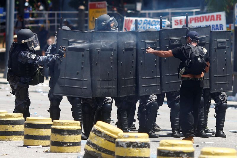 The Rio de Janeiro police keeping order during a protest against the state government in Rio de Janeiro, November 16, 2016. A police chopper crashed November 19 killing four officers. u00e2u20acu201d Reuters pic