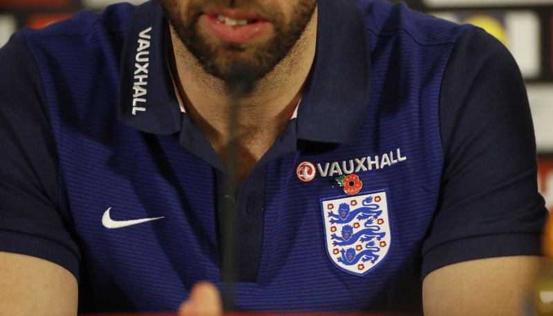Interim manager Gareth Southgate at his pre-match press conference in St George’s Park in Burton upon Trent yesterday in a shirt with a poppy above the England badge.
