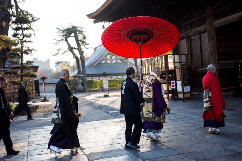 Japanese Buddhist monk Kazuki Yazawa (4th right) walks with other monks after the morning prayers at the courtyard of Zenkoji Buddhist temple in Nagano November 7, 2016. — AFP pic