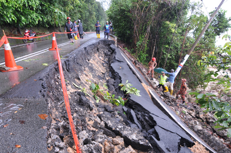 A landslide damaged Jalan Batu Ferringhi leading to Teluk Bahang, occurred after heavy rain early in the morning, November 7, 2016. u00e2u20acu201d Picture by KE Ooi