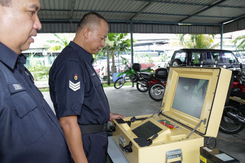 Bomb technicians manning the military technology grade camera that's fitted into the mobile bomb-detecting robot. — Picture by Choo Choy May