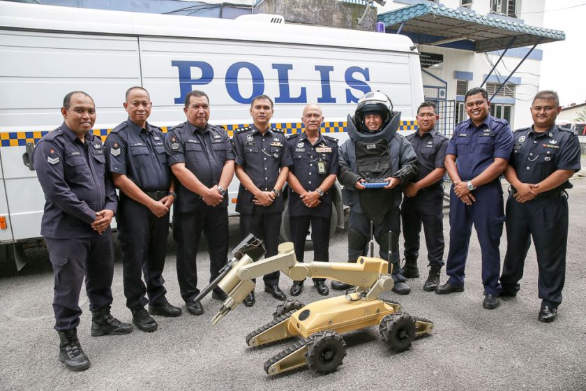 Hamsah (centre) poses for a group picture with some of his Start team members. — Picture by Choo Choy May
