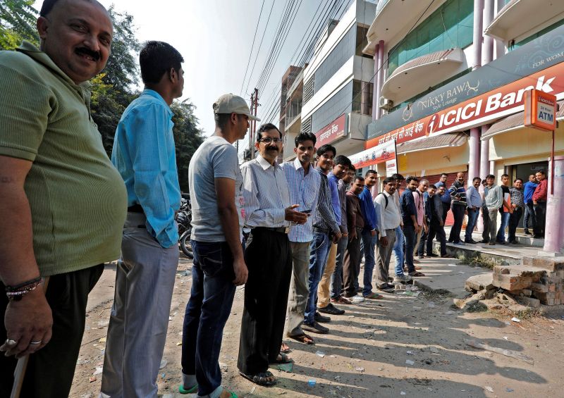People queue to withdraw cash at the ICICI bank ATM in Lucknow, India, November 14, 2016. REUTERS/Pawan Kumar