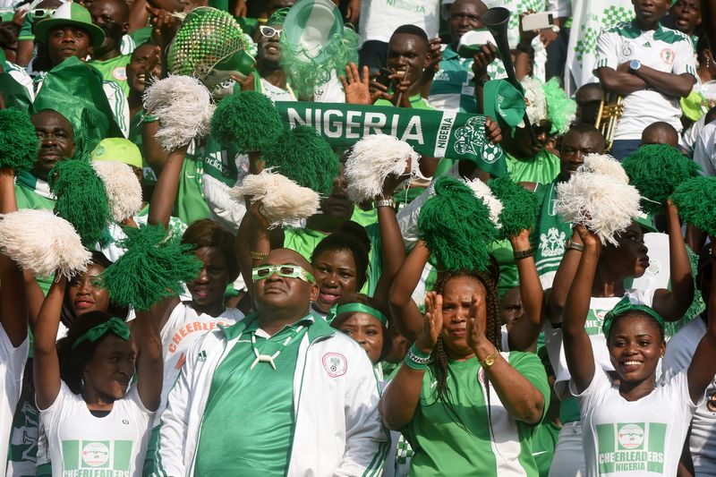 Nigerian fans cheer for their team during the World Cup African zone group B qualifying match against Algeria at the Akwa Ibom State Stadium in Uyo November 12, 2016. u00e2u20acu201d AFP pic