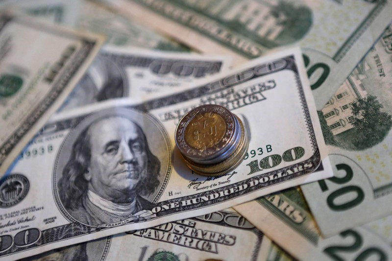 Mexican pesos and US dollar banknotes are seen in this picture illustration, November 3, 2016. u00e2u20acu201d Reuters pic