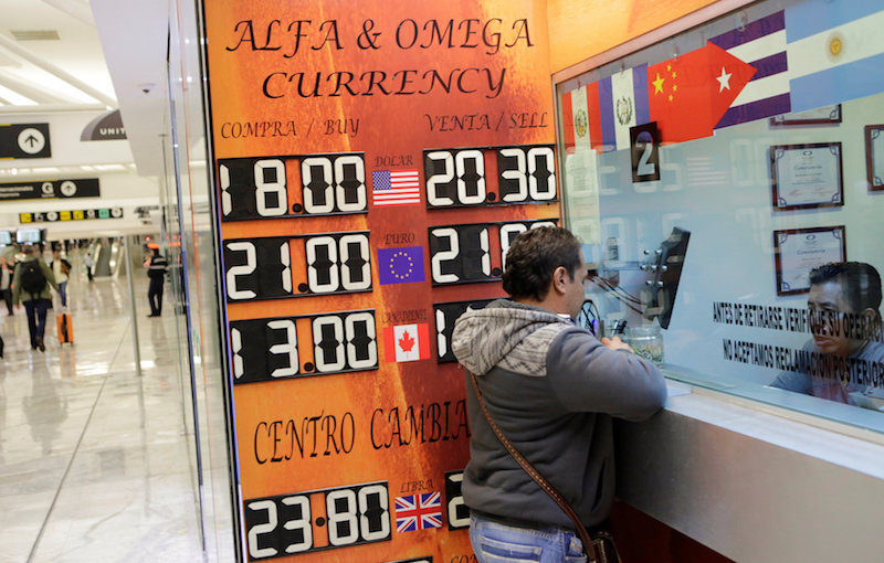 A board displaying the exchange rates of Mexican peso against the US dollar and the euro is seen at a foreign exchange house at the international airport in Mexico City, Mexico November 8, 2016. u00e2u20acu201d Reuters pic