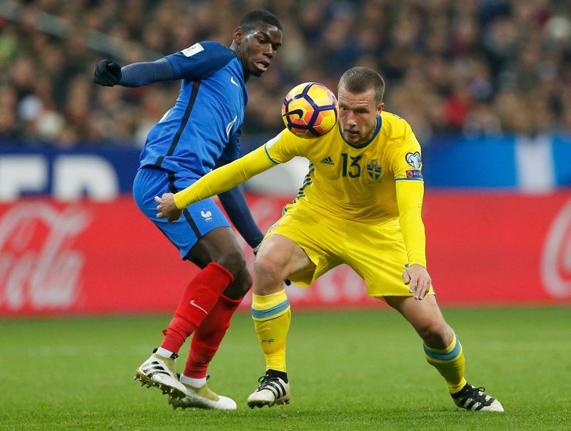 France's Paul Pogba (left) in World Cup qualifying action against Sweden's Emil Krafth at the Stade de France November 11, 2016. u00e2u20acu201d Reuters pic
