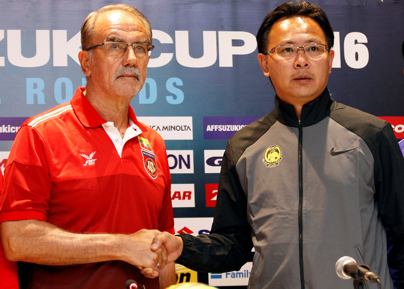 Myanmar coach Gerd Zeise (left) and Malaysiau00e2u20acu2122s coach Ong Kim Swee shake hands during a news conference ahead of the match, in a hotel at Yangon November 25, 2016. u00e2u20acu201d Reuters pic