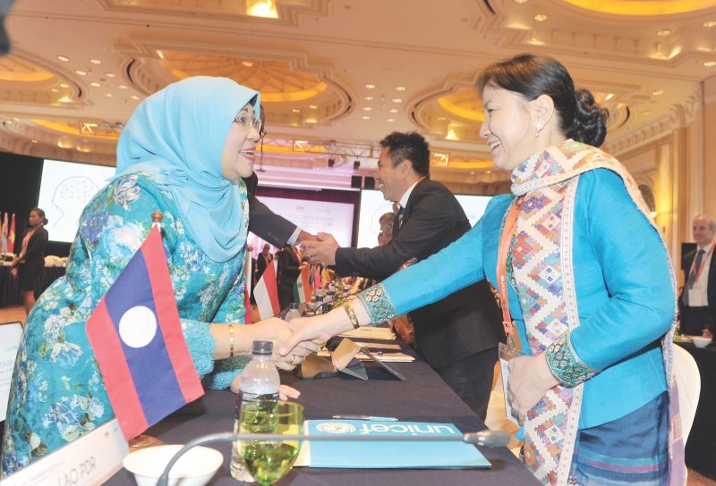 Datuk Seri Rohani Karim greets Laos delegate Dr Inlavanh Keobounphanh at the meeting attended by over 200 delegates from Asia and the Pacific. u00e2u20acu201d Bernama pic