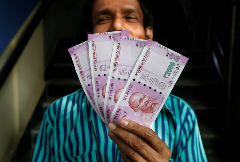 A man displays new 2000 Indian rupee banknotes after withdrawing them from a State Bank of India (SBI) branch in Kolkata, India, November 10, 2016. u00e2u20acu201d Reuters pic