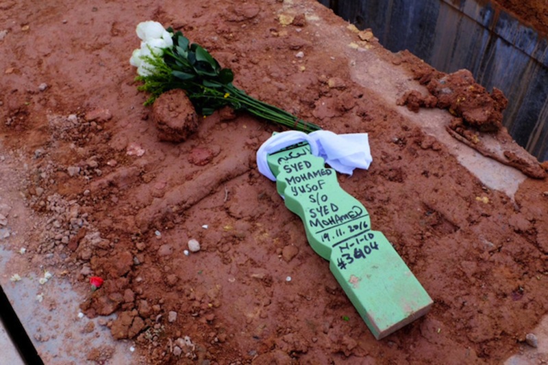 A bouquet of flowers on the grave of Singaporean Syed Yusof who died during the Bintan Reebok Spartan Race. u00e2u20acu201d TODAY picn