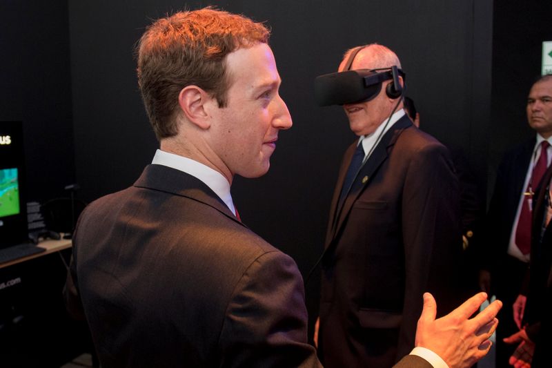 Facebook founder Mark Zuckerberg (left) stands next to Peru's President Pedro Pablo Kuczynski who is using a virtual reality headset during the Asia-Pacific Economic Cooperation Summit in Lima November 19, 2016. u00e2u20acu201d Reuters pic