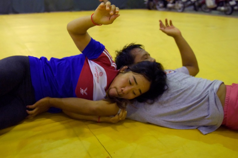 This photo taken on October 7, 2016 shows wrestler Chov Sotheara (left) training with a teammate at the National Olympic stadium in Phnom Penh. u00e2u20acu2022 AFP pic