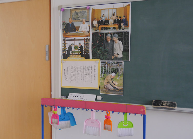 Pictures of the Japanese imperial family are displayed on a blackboard in a classroom at Tsukamoto kindergarten in Osaka November 30, 2016. — Reuters pic