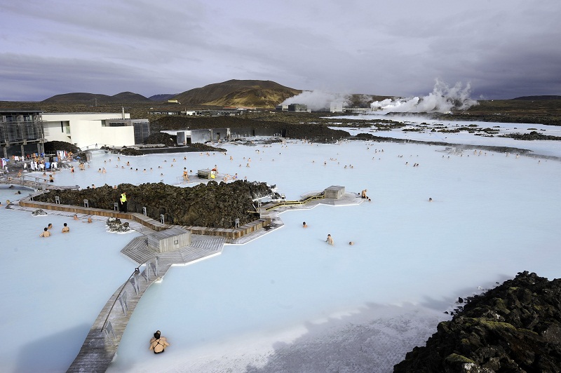 Tourists stand in the Blue Lagoon outside Reykjavik. u00e2u20acu201d AFP pic