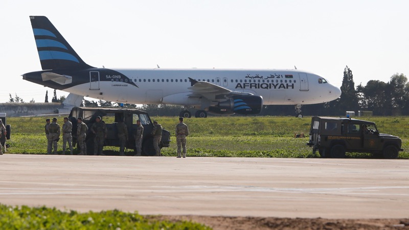 Maltese troops survey a hijacked Libyan Afriqiyah Airways Airbus A320 on the runway at Malta Airport, December 23, 2016. u00e2u20acu201d Reuters pic