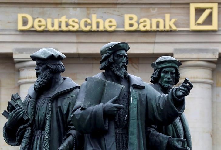 A statue is pictured next to the logo of Germany's Deutsche Bank in Frankfurt, Germany September 30, 2016. u00e2u20acu201d Reuters pic
