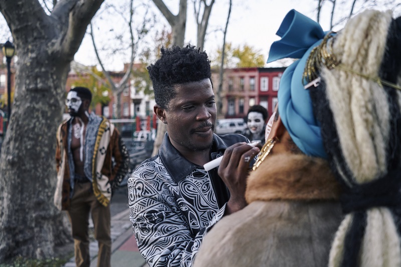Laolu Senbanjo, a Nigerian-born visual artist and musician, paints on the face of Reign Apiim in New York, November 13, 2016. — Picture by An Rong Xu/The New York Times