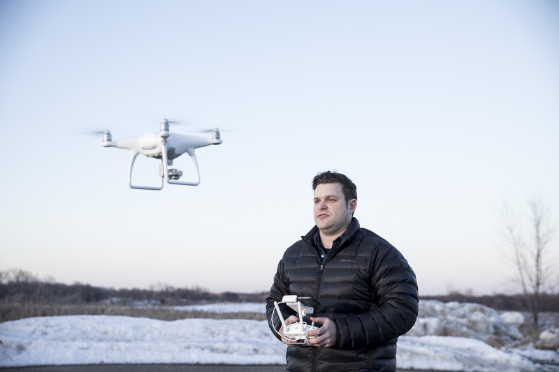 Kyle Christy flies his DJI Phantom 4 drone, in North Saint Paul, Minnesota December 23, 2016.