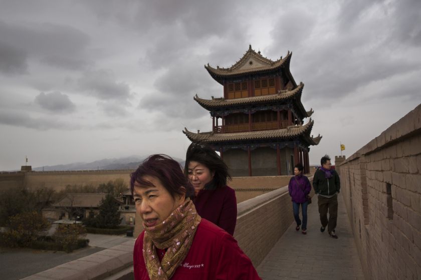 Tourists visit the Jiayuguan Fort, the historic anchor of the westernmost reaches of the Great Wall, in Jiayuguan, China October 25, 2015. — Picture by Adam Dean/The New York Times
