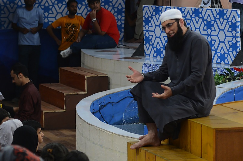 In this photograph taken on August 1, 2013, Pakistani television show host Junaid Jamshed presents an Islamic quiz show Shan-e-Ramadan in Karachi. u00e2u20acu201d AFP pic 