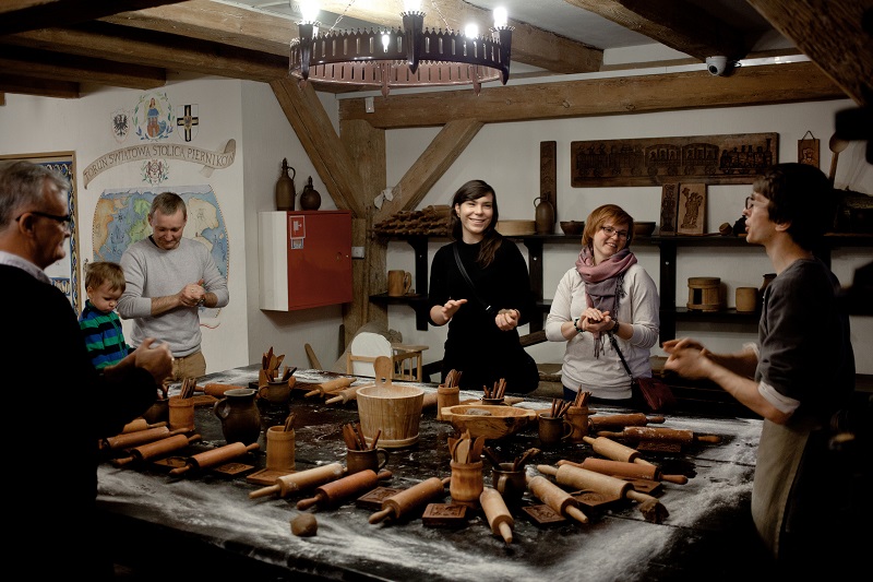 Igor Szeliga (right) explains traditional baking techniques at the Living Museum of Gingerbread in Torun, Poland, November 26, 2016. Pierniki, as the aromatic gingerbread cookies are known here, are so associated with Torun that the city has not one but two museums dedicated to them. — Picture by Piotr Malecki/The New York Times