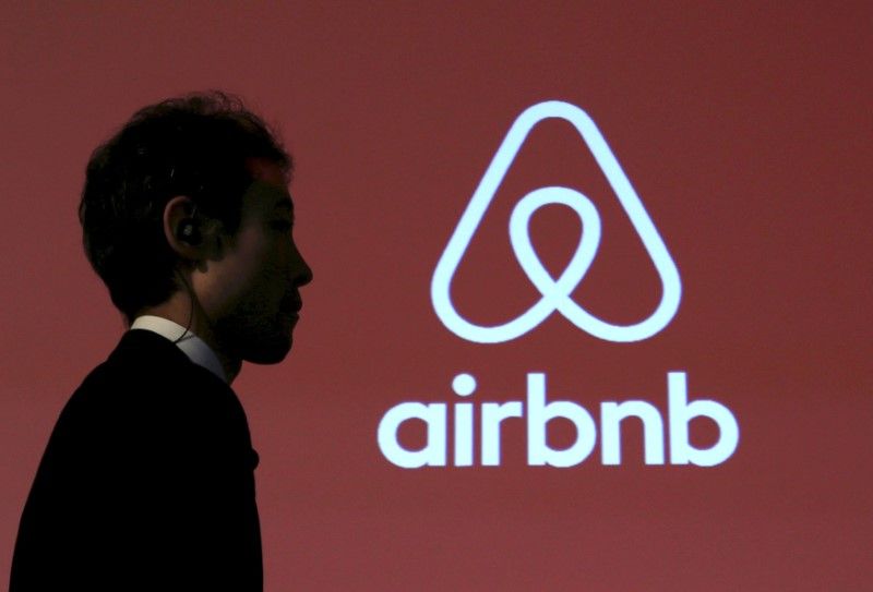 A man walks past a logo of Airbnb after a news conference in Tokyo, Japan, November 26, 2015. u00e2u20acu201d Reuters pic