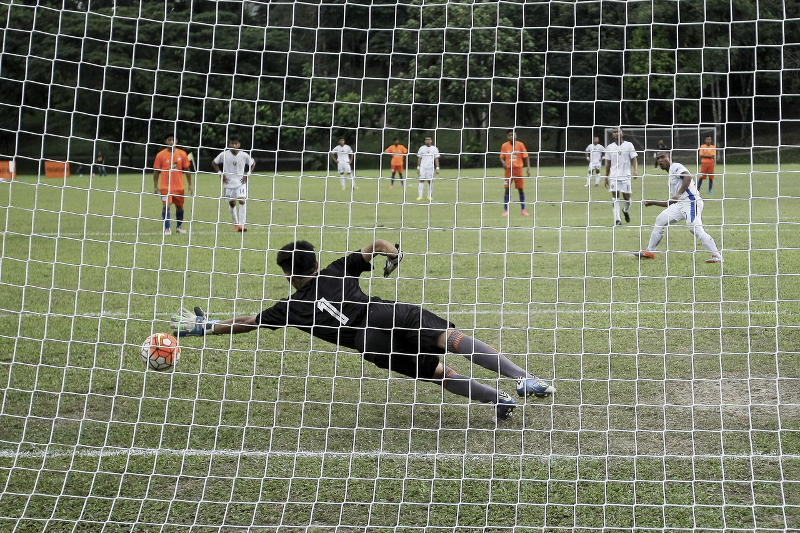 Malaysiau00e2u20acu2122s Muhammad Rahmatuddin Mohd Huzaizi (right) scores a goal in the match against Myanmar at the 2016 Asean Deaf People Football Championship at the National Sports Complex, Bukit Jalil December 7, 2016. u00e2u20acu201d Bernama pic