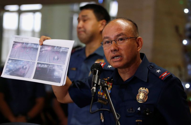 Philippines' Chief Superintendent Oscar Albayalde shows a copy of a closed circuit television printout, showing men involved in a foiled bomb attack plot in Manila on November 28, in Manila, December 7, 2016. u00e2u20acu201d Reuters pic