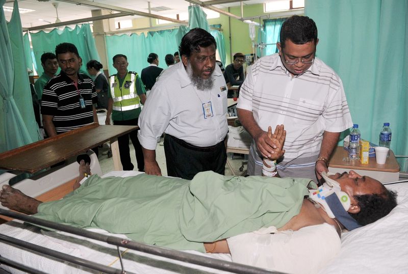 Johor state health and environment ex-co chairman Datuk Ayub Rahmat accompanied by hospital director Dr Selahuddeen Abdul Aziz visit bus crash survivor Govindara Raj, 50, at the Hospital Pakar Sultanah Fatimah, December 25, 2016. u00e2u20acu201d Bernama pic