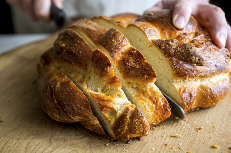 An olive oil challah loaf is cut into thick slices in New York December 9, 2016. u00e2u20acu201d Picture by Andrew Scrivani/The New York Times