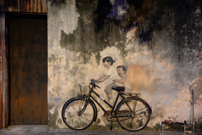 Zacharevic's mural of children on a bicycle in Armenian Street, Penang is one of his most iconic artwork. u00e2u20acu2022 Picture by KE Ooi
