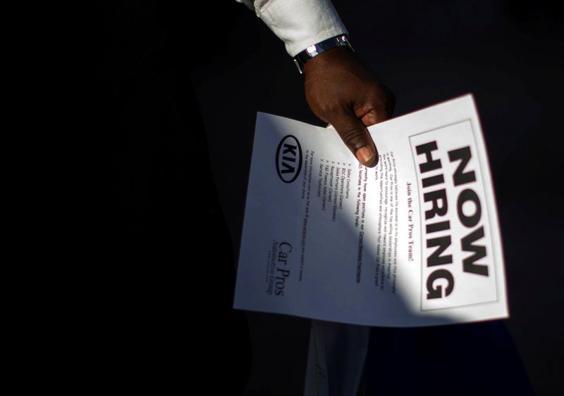 A man holds a leaflet at a military veterans' job fair in Carson, California October 3, 2014. u00e2u20acu201d Reuters pic