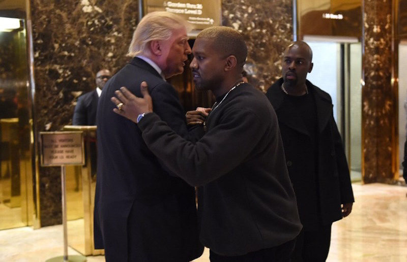 Singer Kanye West and President-elect Donald Trump talk at Trump Tower after meetings in New York December 13, 2016. — AFP pic