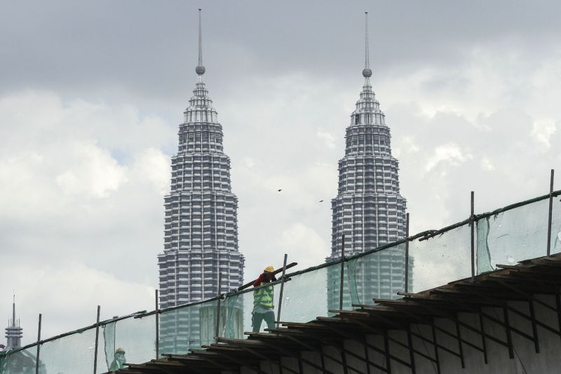 A worker is seen at a construction site near the Petronas Twin Towers in Kuala Lumpur December 15, 2016. u00e2u20acu2022 Picture by Yusof Mat Isa