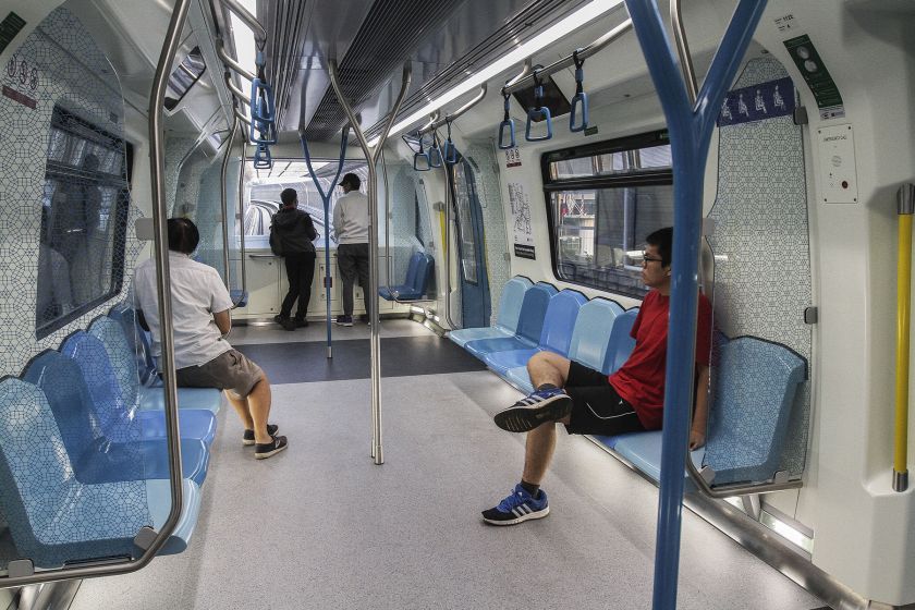 Commuters catch a ride on the maiden MRT service, which will be free to the public for a period of one month. u00e2u20acu201d Picture by Yusof Mat Isa