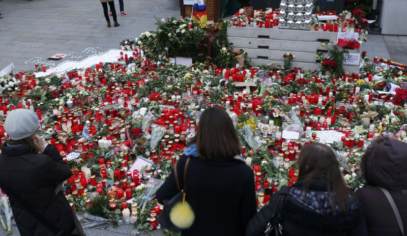 Flowers and candles are placed near the Christmas market at Breitscheid square in Berlin, Germany, December 22, 2016, following an attack by a truck which ploughed through a crowd at the market on Monday night. u00e2u20acu201d Reuters pic