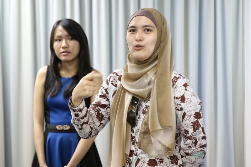 Yana Rizal (right) says the quiz ― which is in Bahasa Malaysia ― has a distinct Malaysian flavour to it with hints at local culture and is styled more like a game.