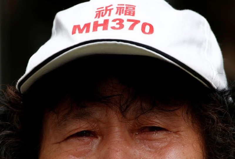 A family member of a passenger aboard Malaysia Airlines flight MH370 which went missing in 2014 reacts during a protest outside the Chinese foreign ministry in Beijing July 29, 2016. u00e2u20acu201d Reuters pic