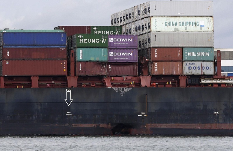 The APL Denver, anchored at Pasir Gudang Port. Damage to the hull can be seen just at the waterline. u00e2u20acu201d TODAY pic